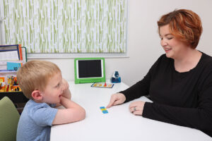 A tutor works with a child on spelling skills using The Barton Reading & Spelling System.